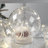 Sfera natalizia LED Mascagni Casa in vetro con decorazioni interne 15 cm